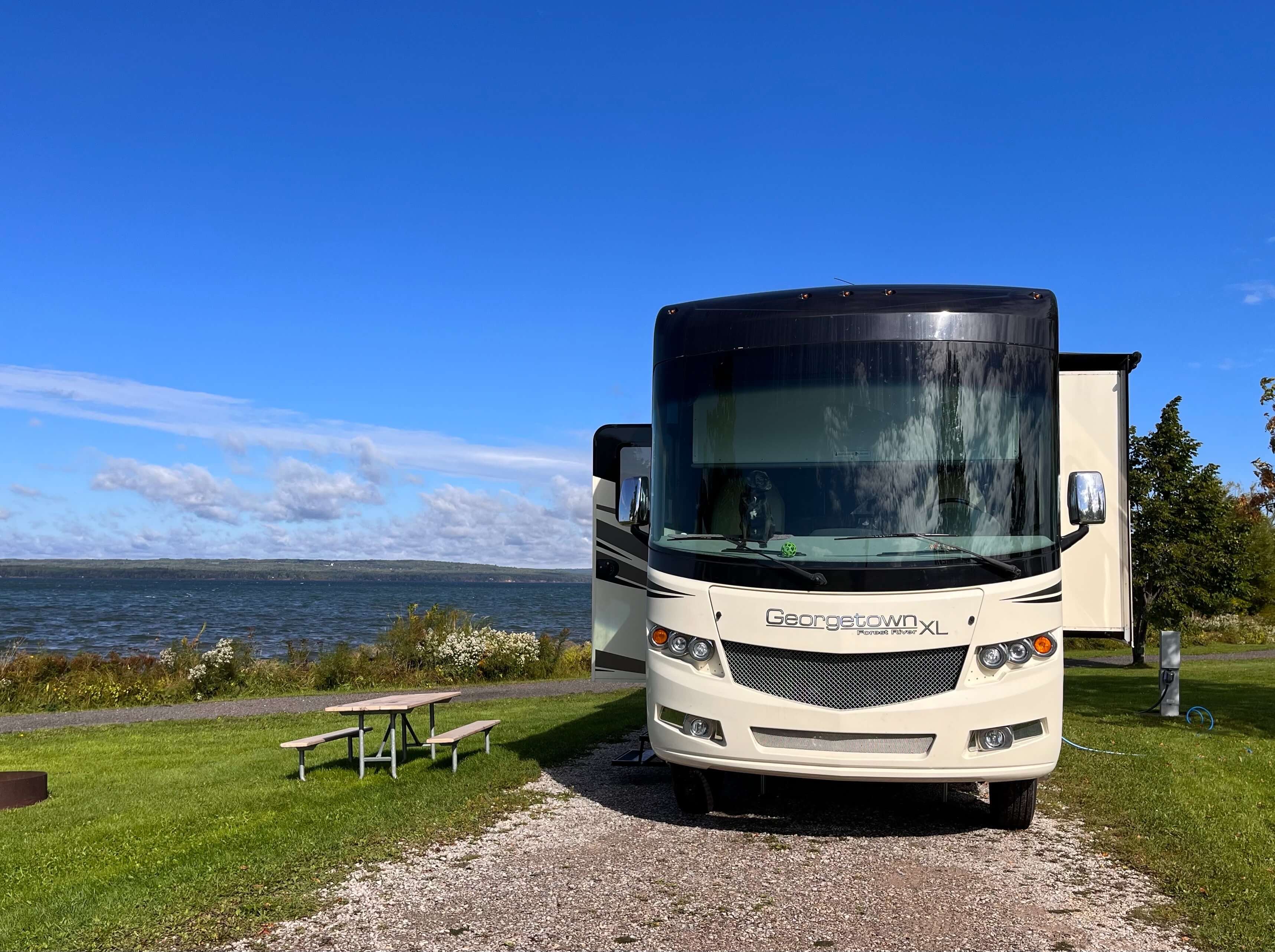 motorhome with lake in background